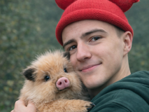 Rylan MacAskill with a haglet during field observations with the Haggis Guardian Institute of Study